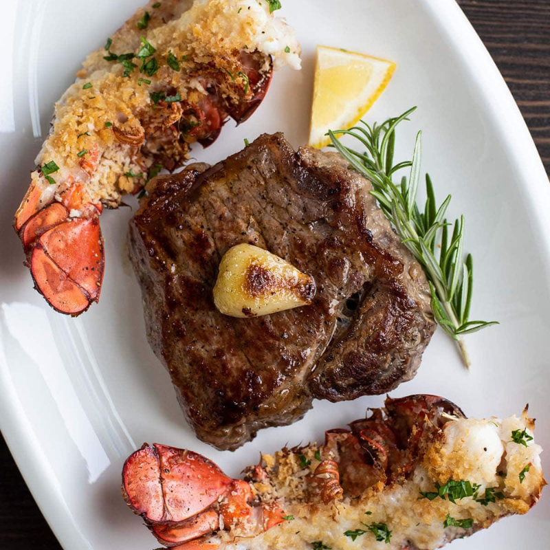 Petite filet and a broiled lobster tail with all the Fixin's, sauteed green beans & garlic mashed potatoes. | 6oz tenderloin and 8oz cold water lobster tail.